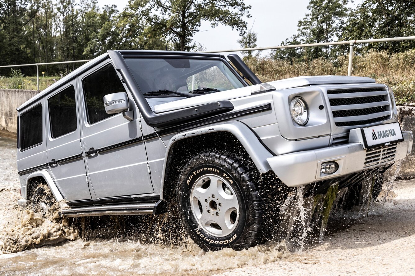 Fording A vehicle is passing the deep fording basin filled with water